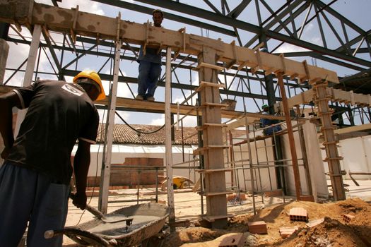 porto seguro, bahia / brazil - november 10, 2010: civil construction workers are seen working on renovating the airport in the city of Porto Seguro, in southern Bahia.