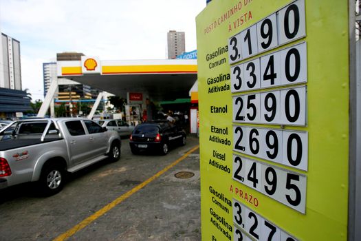 salvador, bahia / brazil - october 8, 2014: plate with fuel prices is seen at the entrance of a gas station in the city of Salvador.


