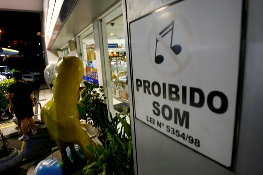 salvador, bahia / brazil - october 10, 2014: sign at gas station informs about automotive sound prohibition in the city of Salvador.