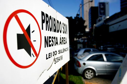 salvador, bahia / brazil - october 10, 2014: sign at gas station informs about automotive sound prohibition in the city of Salvador.