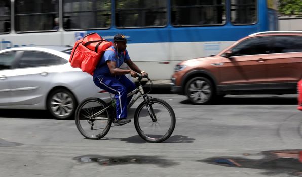 salvador, bahia/brazil - October 8, 2019: Food delivery man rides his bike through the streets of Salvador.