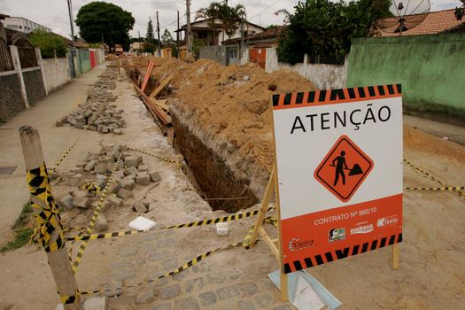 eunapolis, bahia / brazil - november 8, 2010: hole dug for the implementation of a sewage system in a street in the municipality of Eunapolis, southern Bahia.
