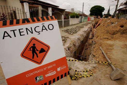 eunapolis, bahia / brazil - november 8, 2010: hole dug for the implementation of a sewage system in a street in the municipality of Eunapolis, southern Bahia.
