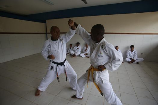 salvador, bahia / brazil - november 8, 2018: public school students from Bairro da Paz in Salvador are seen practicing karate in the school's field.