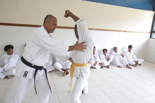 salvador, bahia / brazil - november 8, 2018: public school students from Bairro da Paz in Salvador are seen practicing karate in the school's field.