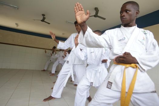 salvador, bahia / brazil - november 8, 2018: public school students from Bairro da Paz in Salvador are seen practicing karate in the school's field.