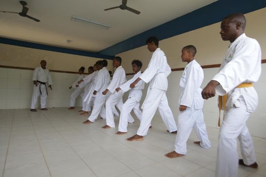 salvador, bahia / brazil - november 8, 2018: public school students from Bairro da Paz in Salvador are seen practicing karate in the school's field.