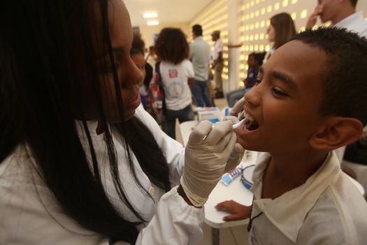 salvador, bahia / brazil - november 8, 2018:  Student of public school in the Bairro da Paz in Salvador learn to brush their teeth during social action. 