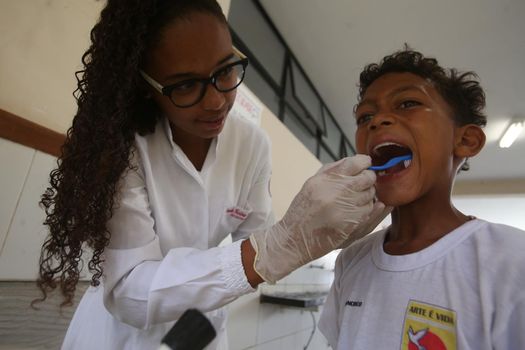 salvador, bahia / brazil - november 8, 2018:  Student of public school in the Bairro da Paz in Salvador learn to brush their teeth during social action. 