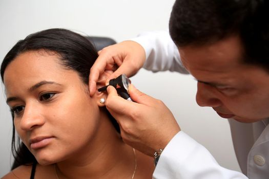 salvador, bahia / brazil - april 10, 2019: otorhino doctor undergoes an otoscopy on a patient in the city of Salvador.