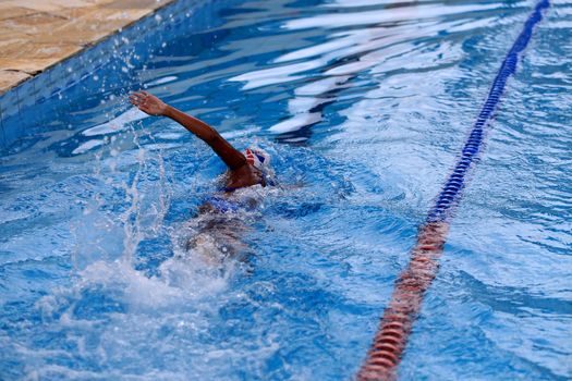 salvador, bahia / brazil - april 10, 2019: person is seen swimming in olympic pool in the city of Salvador.
