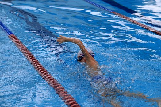 salvador, bahia / brazil - april 10, 2019: person is seen swimming in olympic pool in the city of Salvador.
