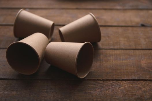 ecological kraft paper cups for coffee and tea dark brown on the table