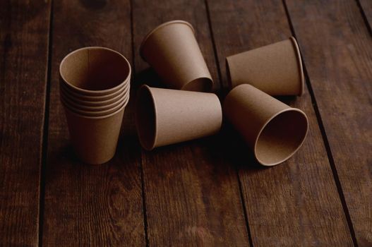 ecological kraft paper cups for coffee and tea dark brown on the table