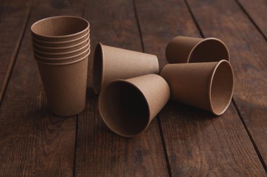 ecological kraft paper cups for coffee and tea dark brown on the table