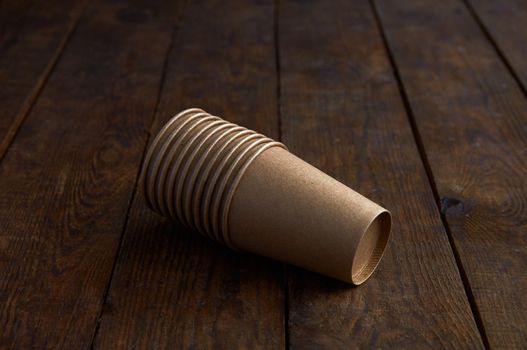 ecological kraft paper cups for coffee and tea dark brown on the table