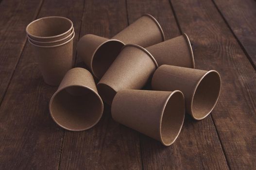 ecological kraft paper cups for coffee and tea dark brown on the table