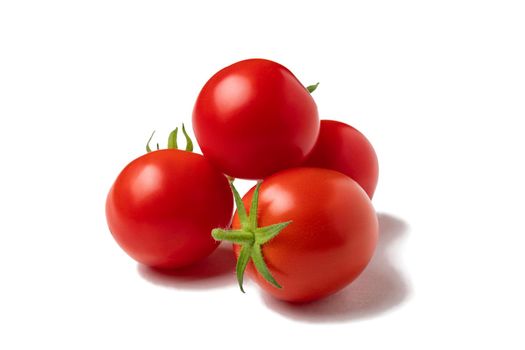 Several ripe whole cherry tomatoes isolated on white background.