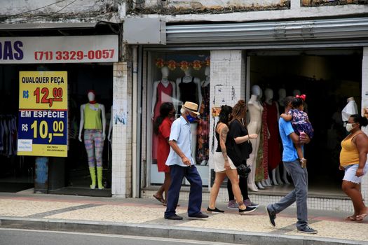 salvador, bahia, brazil - december 14, 2020: movement of people using a protective mask against the corona virus, in a street store in downtown Salvador.