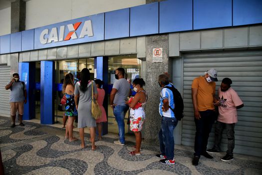 salvador, bahia, brazil - december 14, 2020: people are seen in line at Caixa Economica Federal, in downtown Salvador.