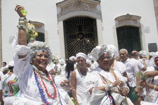 salvador, bahia / brazil - january 15, 2015: Baianas wash the stairs of the Church of Bonfim, during traditional party for Catholics and Candomble fan.