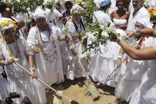 salvador, bahia / brazil - january 15, 2015: Baianas wash the stairs of the Church of Bonfim, during traditional party for Catholics and Candomble fan.