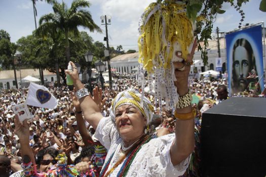 salvador, bahia / brazil - january 15, 2015: Baianas wash the stairs of the Church of Bonfim, during traditional party for Catholics and Candomble fan.