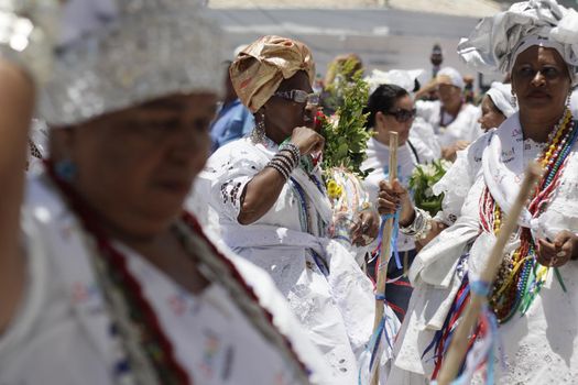 salvador, bahia / brazil - january 15, 2015: Baianas wash the stairs of the Church of Bonfim, during traditional party for Catholics and Candomble fan.