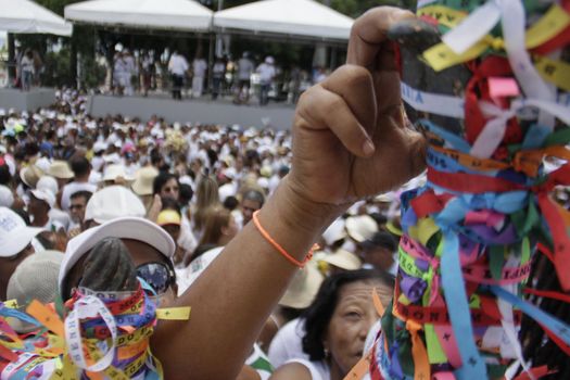 salvador, bahia / brazil - january 15, 2015: Candomble fans and devotees of Senhor do Bonfim accompany the traditional washing of the stairs of the Bonfim Church in Salvador.