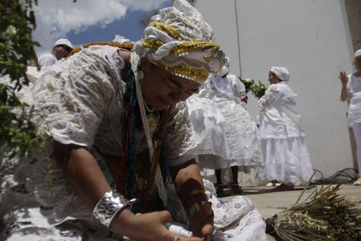 salvador, bahia / brazil - january 15, 2015: Baianas wash the stairs of the Church of Bonfim, during traditional party for Catholics and Candomble fan.