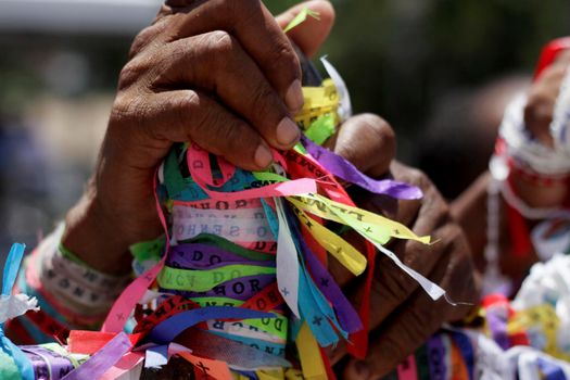 salvador, bahia, brazil - january 15, 2015: devotees of candomble and catholics participate in the washing phase of the staircases of the church of Bonfim in the city of Salvador.