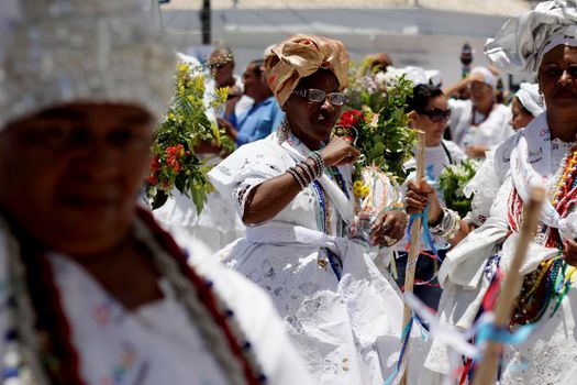 salvador, bahia, brazil - january 15, 2015: devotees of candomble and catholics participate in the washing phase of the staircases of the church of Bonfim in the city of Salvador.