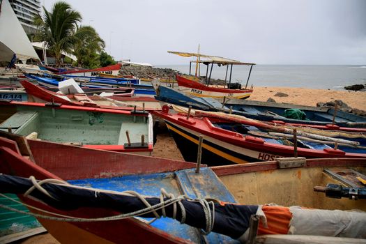 salvador, bahia, brazil - january 15, 2021: fishing boats are seen collected in the sand of Paciencia beach, in the Rio Vermelho neighborhood, in the city of Salvador, due to rainy weather.