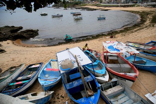 salvador, bahia, brazil - january 15, 2021: fishing boats are seen collected in the sand of Paciencia beach, in the Rio Vermelho neighborhood, in the city of Salvador, due to rainy weather.