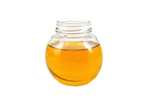 Vegetable oil in glass jar isolated on white background