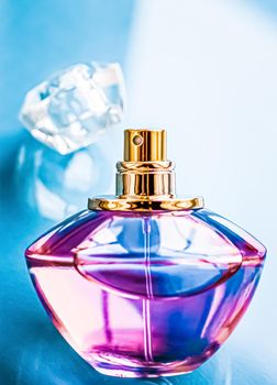 Perfume bottle on glossy background, sweet floral scent, glamour fragrance and eau de parfum as holiday gift and luxury beauty cosmetics brand design.