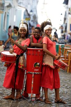 salvador, bahia / brazil - february 19, 2019: children from Banda Dida are seen next to musical instruments at Pelourinho in the city of Salvador.