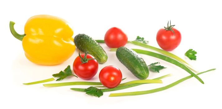 cucumbers, peppers, tomatoes and green onions isolated on white