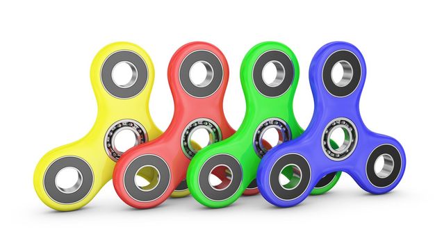 Spinners of different colors with ball bearings. 3d rendering.