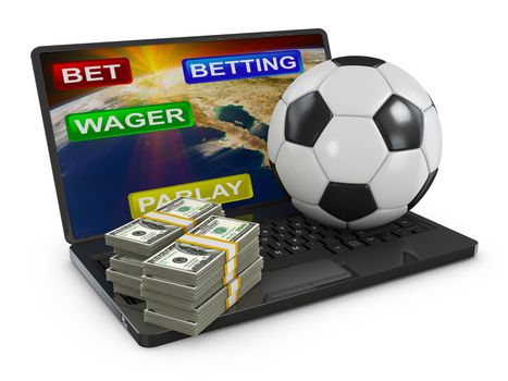 packs of dollars and a soccer ball on a laptop