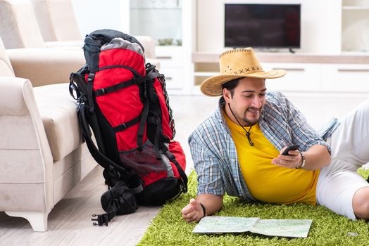 Man planning his travel with map
