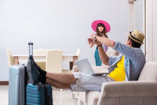 Young family packing for vacation travel