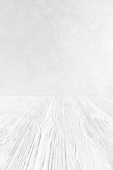Empty white wooden surface against gray decorative plaster or concrete background. Mockup for design.