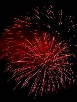 Colorful fireworks isolated on black sky background.