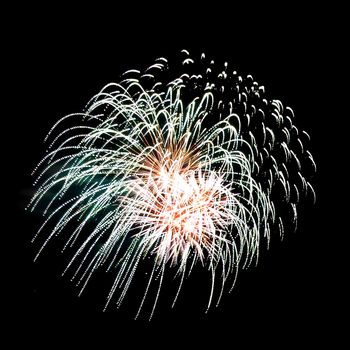 Colorful fireworks isolated on black sky background.