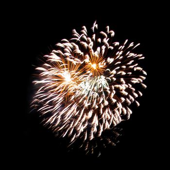 Colorful fireworks isolated on black sky background.