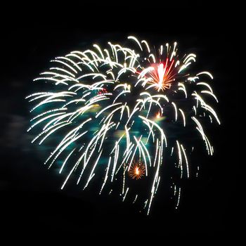 Colorful fireworks isolated on black sky background.