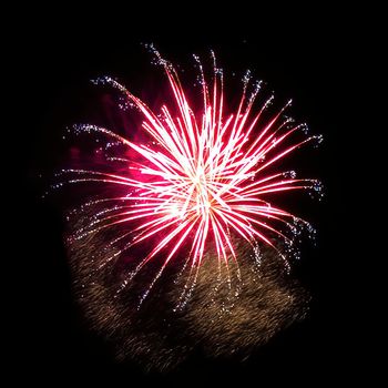 Colorful fireworks isolated on black sky background.