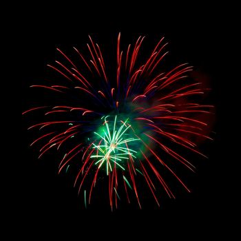 Colorful fireworks isolated on black sky background.