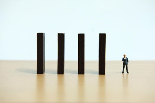 Business strategy conceptual photo - Miniature of businessman stands at the edge of wooden bridge staircase. Image photo